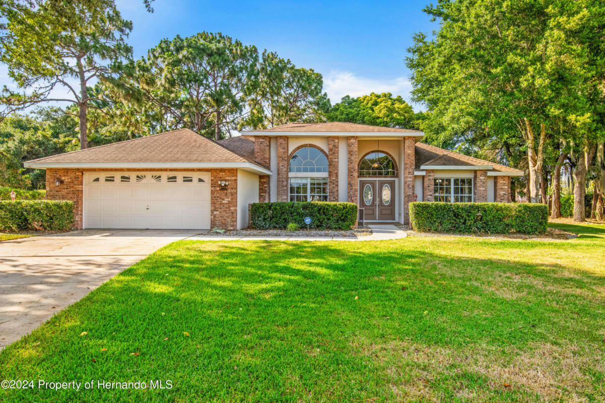 223 FOREST WOOD CT, SPRING HILL, FL 34609, photo 1 of 52