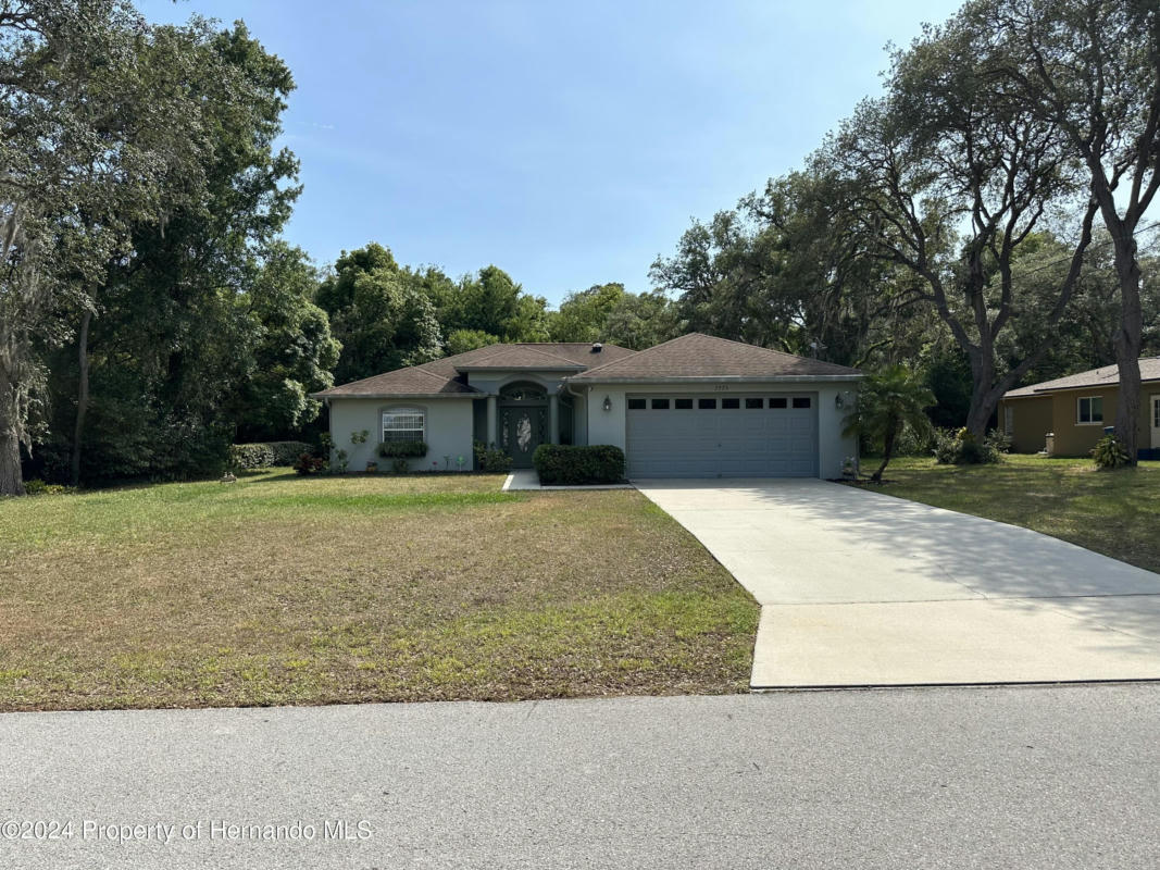 7775 HOLIDAY DR, SPRING HILL, FL 34606, photo 1 of 38